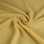 Tricot stof lurex okergeel