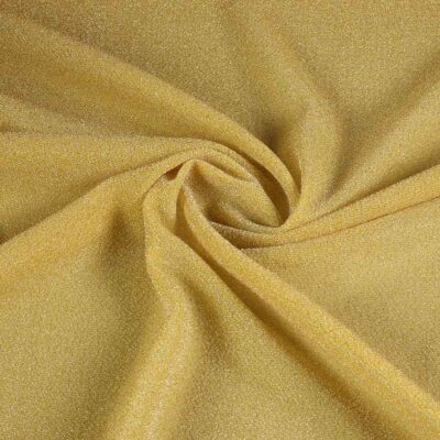 Tissu tricot lurex jaune ocre