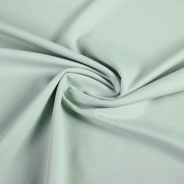 Tissu tricot vert de gris clair