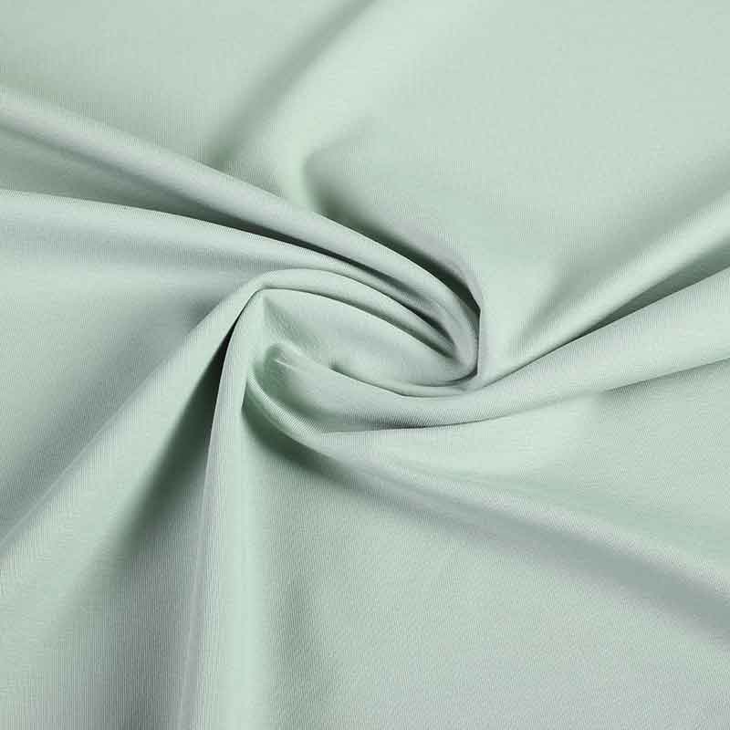 Tissu tricot vert de gris clair