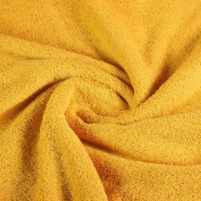 Tissu éponge jaune ocre