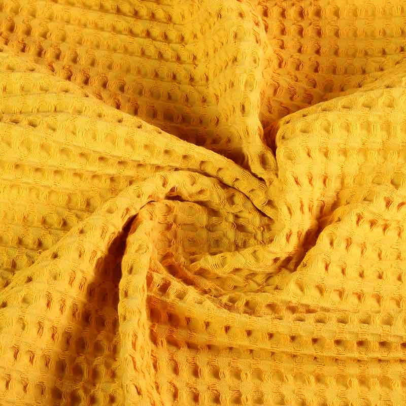 Tissu gaufré grand jaune ocre
