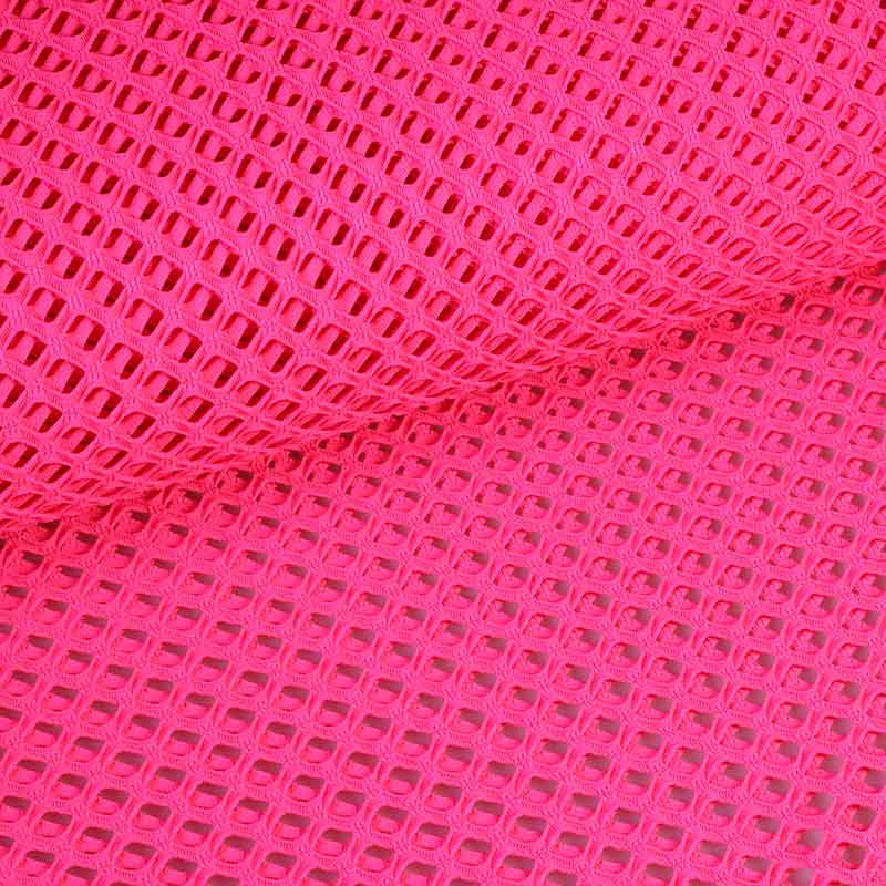 Tissu filet élastique grossier fluor rose